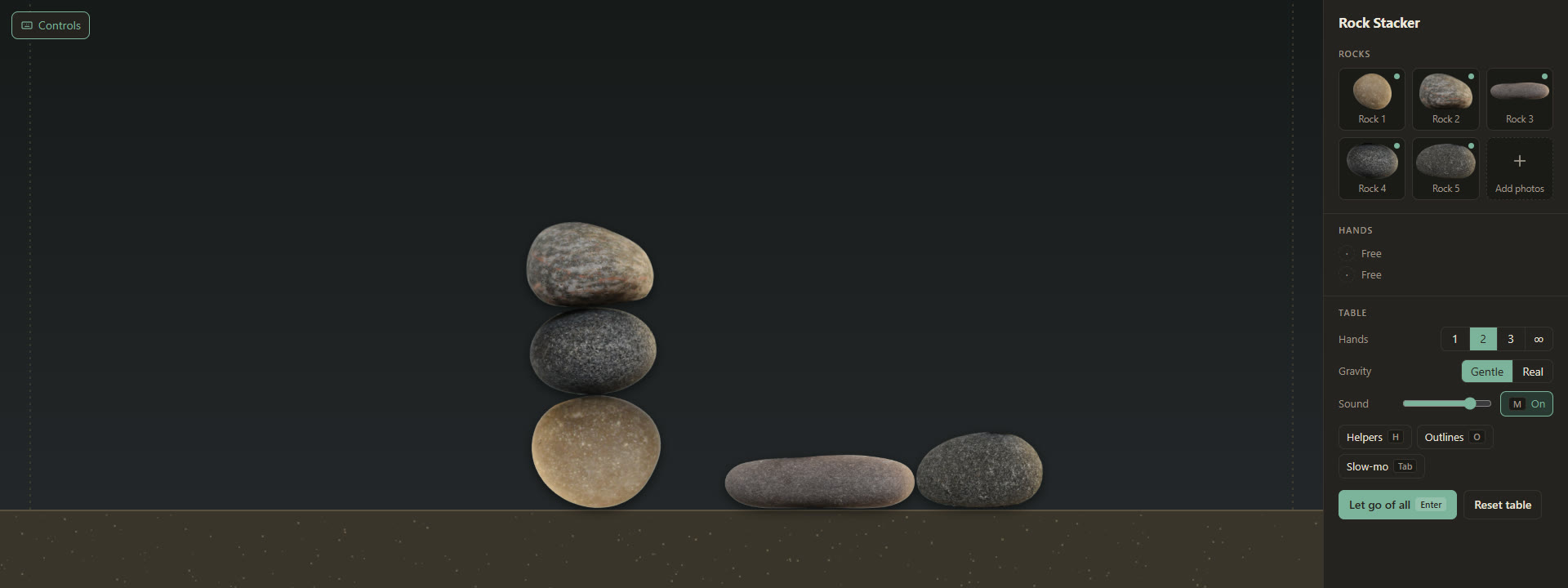 Three rocks balanced in a tower on the Rock Stacker table, two more beside it, with the rock list and table settings on the right.